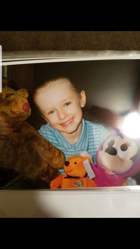 Identifying a Stuffed Reindeer - young girl holding some stuffies