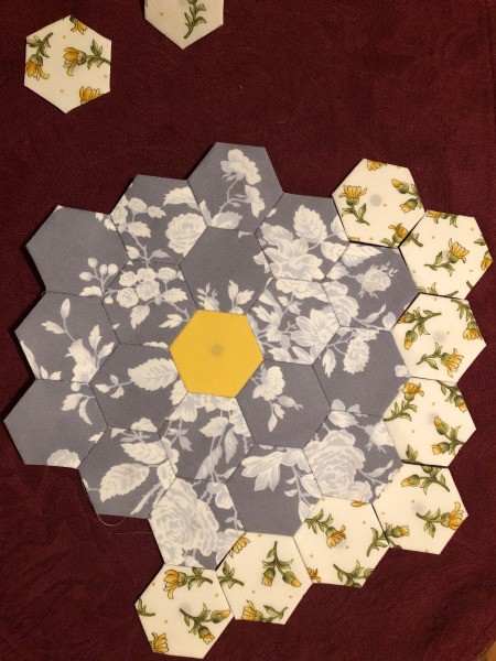English Paper Pieced Flower Pillow - laying out the yellow hexagons to position them prior to sewing in place