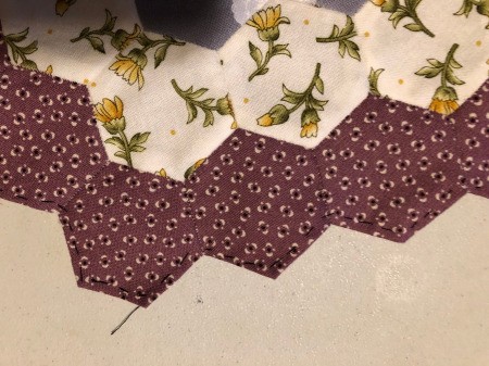 English Paper Pieced Flower Pillow - after removing the paper templates baste the outer folded under edge