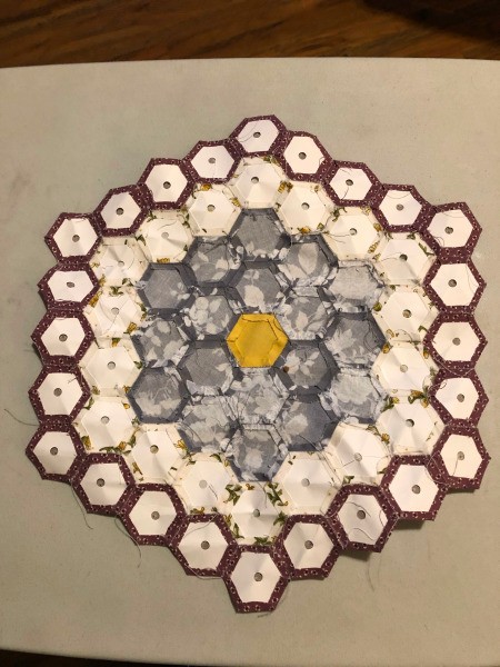 English Paper Pieced Flower Pillow - back side of the flower with the paper templates still in place