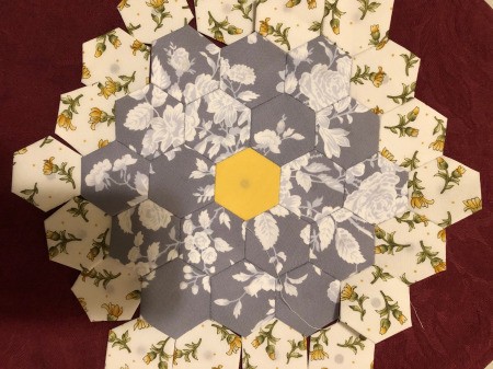 English Paper Pieced Flower Pillow - yellow round partially stitched on