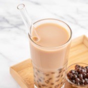 A glass of bubble tea with milk.