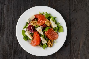 A salad containing grapefruit.