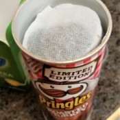 Round tea bags stored inside a Pringles container.
