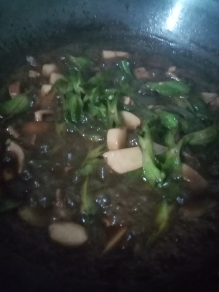 Cuttlefish Cubes with Star Beans simmwring in pan