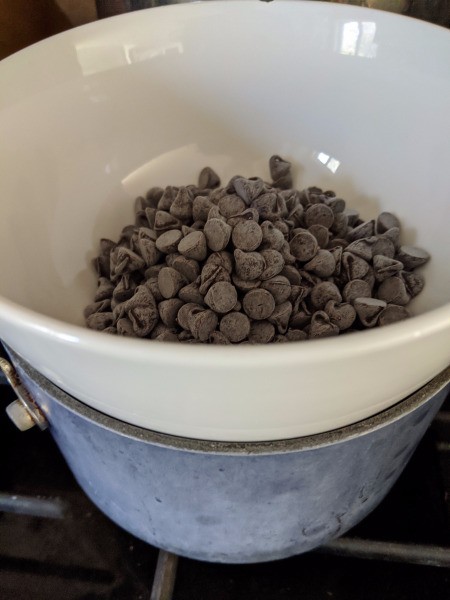 Chocolate chips on top of double boiler
