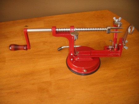 An apple peeler and corer.