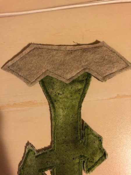 English Paper Pieced Flower Pillow - closeup of flower crown from the back to show the felt