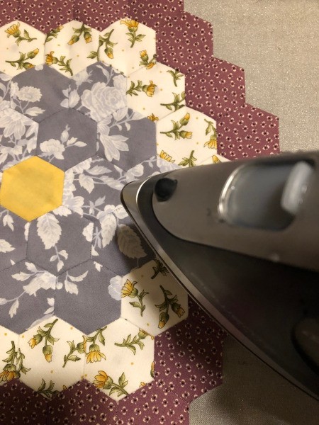 English Paper Pieced Flower Pillow - pressing the flower