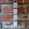 Snowman/Joy Paper Chain Ornament - hanging on the brick fireplace