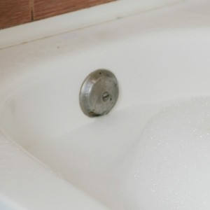 A bathtub's overflow drain.