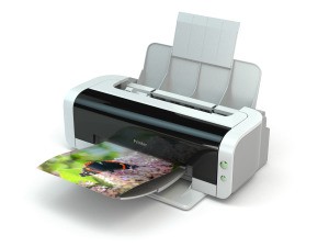 A printer with a photo print in the tray.