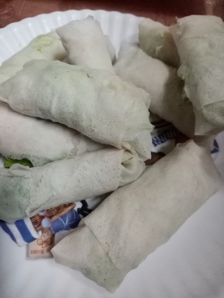 uncooked Leafy Cheese Rolls on plate