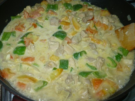 mixing Chicken Curry With Fresh Coconut Milk