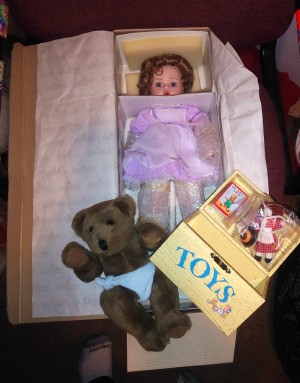 Value of an Ashton Drake Porcelain Doll - doll in the box, with teddy and toy box
