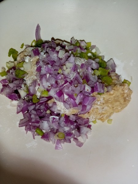adding onions & peppers to dough