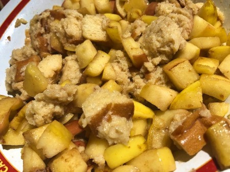adding apples to bread mixture