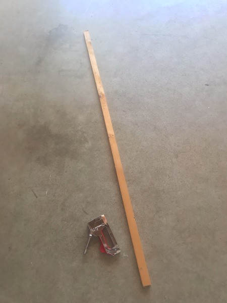 A long stick and a stapler.