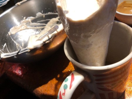 meringue batter in piping tube