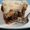 A piece of shoo fly pie on a plate.