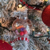 Quick and Sentimental Ornaments - clear plastic ornament with beads inside hanging on the tree