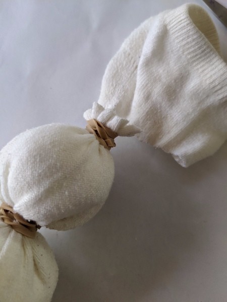 No-Sew Christmas Sock Snowman - excess sock above the second rubber band