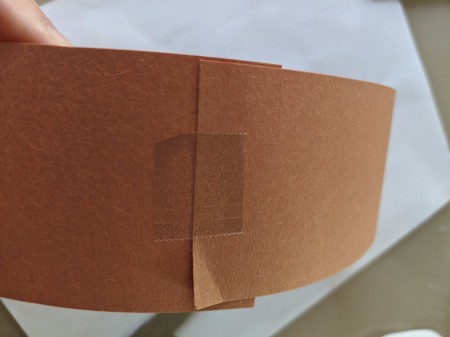 Reindeer Handprint Antler Hat - taping construction paper band together