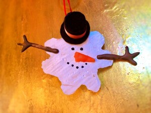 Melted Snowman Ornament - melted snowman ornament on light wood surface