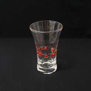 Identifying a Drinking Glass - clear glass with raised glass squares in red and a darker color encircling it a third of the way up from the bottom