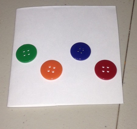 Button Christmas Cards - 4 buttons glued to the card, at alternating high and low positions