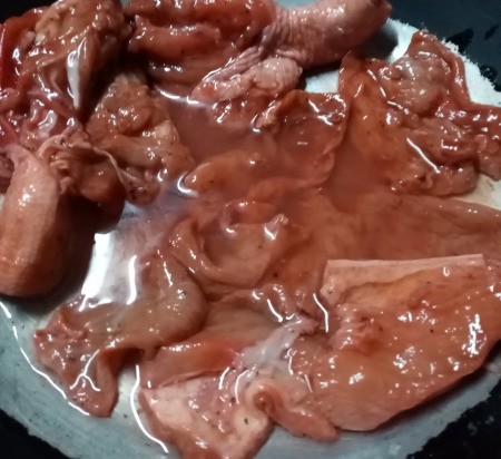marinaded meat in pan