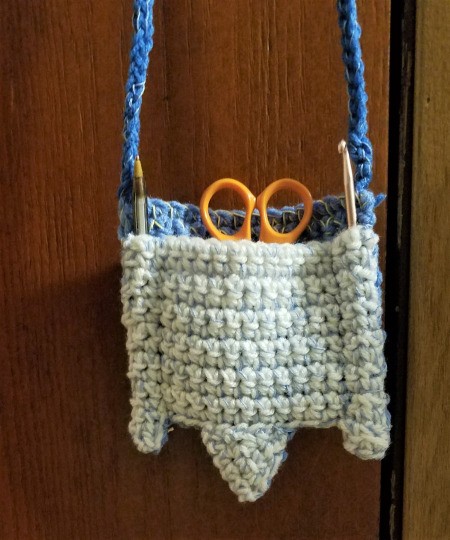 Crocheted Pouch with Lanyard for Crafting Supplies - pouch filled and hanging from lanyard
