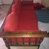 Value of a Conant Ball Couch - wood couch with red upholstered cushions