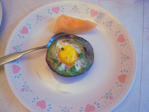 Baked Eggs in Avocado on plate
