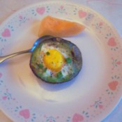 Baked Eggs in Avocado on plate