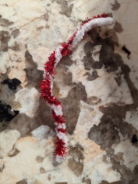 Making Popsicle Stick Snowflake Ornaments - twisted pipe cleaners for a hanger