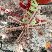 Making Popsicle Stick Snowflake Ornaments - ornament on the tree