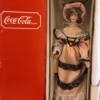 Value of a Coca Cola Heritage Doll - doll in box wearing a Victorian era dress and hat