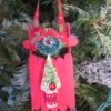 Popsicle Stick Sled - red sled with wreath and tree decorations, hanging on the Christmas tree