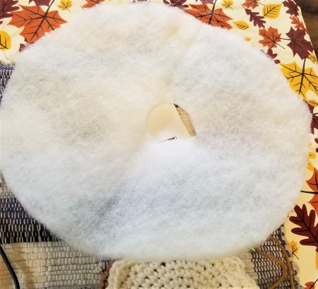 Crocheted Donut Pincushion - piece of batting with a hole in the center