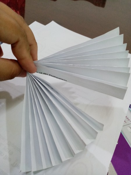 Wiggly Paper Snowman - fold in half, secure the center with string or staple