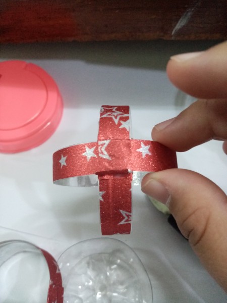 Recycled Plastic Bottle Christmas Balls - one section glued to another in a cross