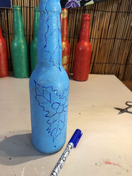 Recycled Bottle Holly Leaf Candlestick Holder - holly leaves drawn onto the bottle with a marker
