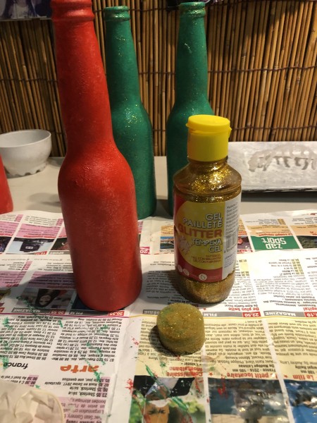 Recycled Bottle Gold Leaf  Candlestick Holders - red and green bottles with a container of gold glitter