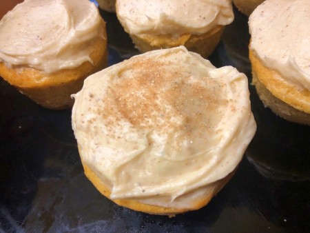 sprinkled cinnamon sugar on Frosted Eggnog Cupcakes