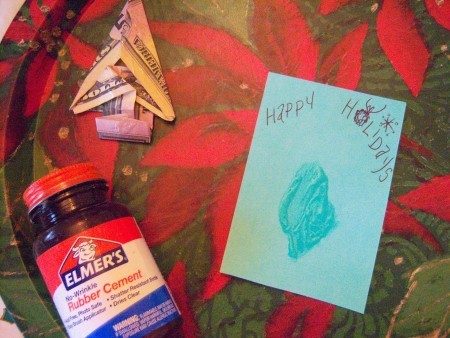 Cash Trees As Gifts - blue index card, rubber cement jar, and folded money