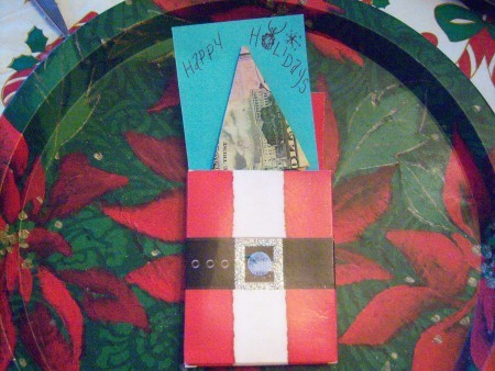 Cash Trees As Gifts - slipping an index card with the tree attached into a Santa gift envelope