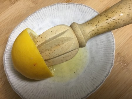 juicing lemon with tool