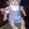 Identifying a Porcelain Doll - doll in blue pants, striped vest and white sirt