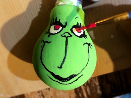 Light Bulb Grinch Ornament - paint in red pupils
